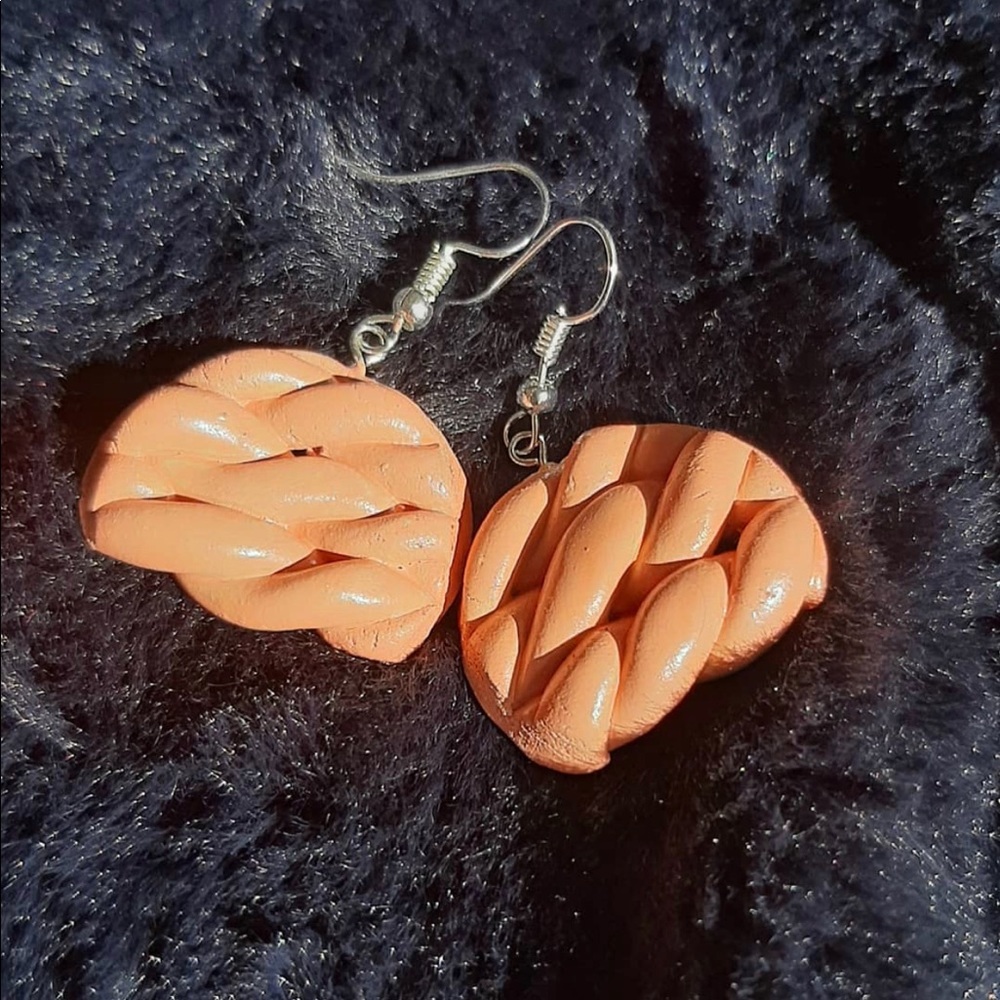 Perfectly braided handmade clay earrings.
